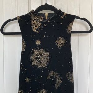 Black velvet ecoté dress, gold glitter zodiac